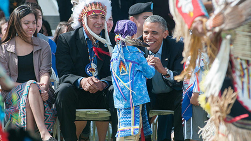 President Obama and SRST Chair Dave Archambault II greet a young dancer during a June 2014 visit